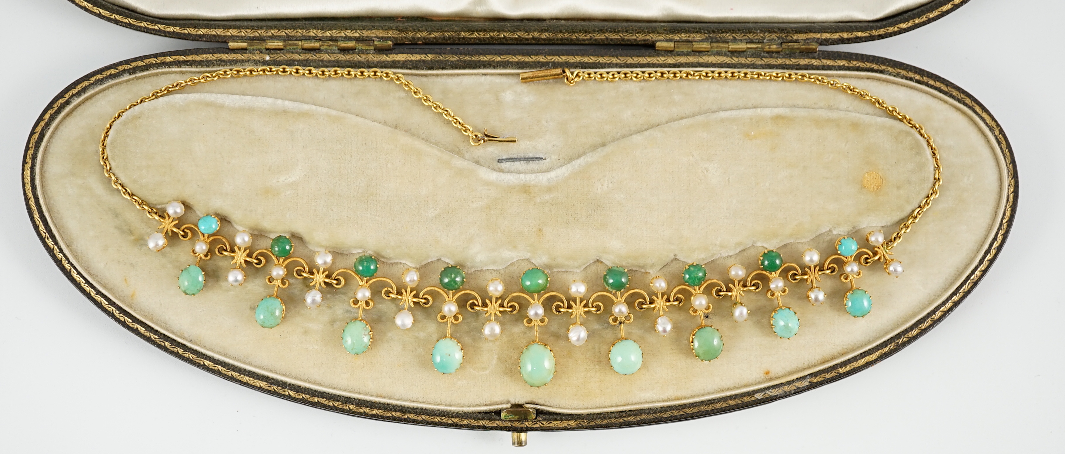 A cased Edwardian gold, turquoise and split pearl set necklace